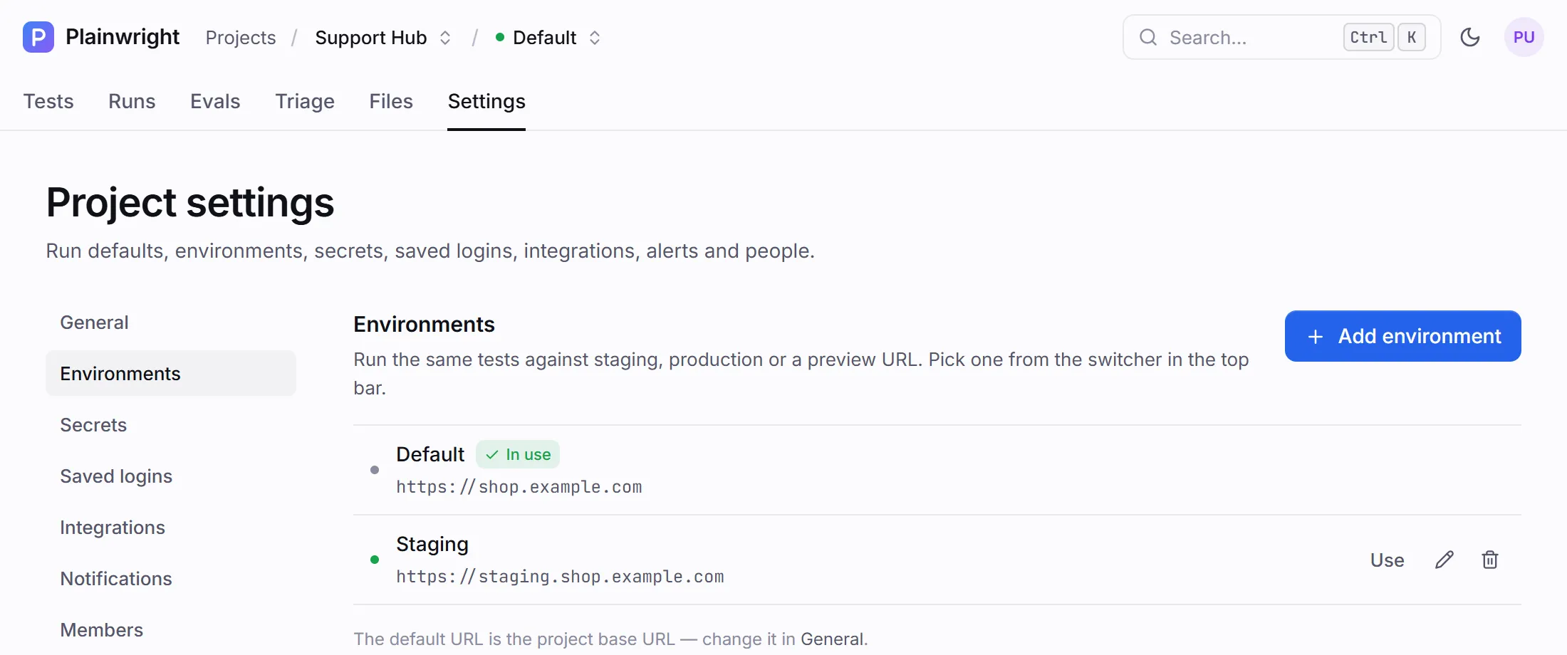 Project settings, Environments: Default (in use) and Staging, each with its base URL